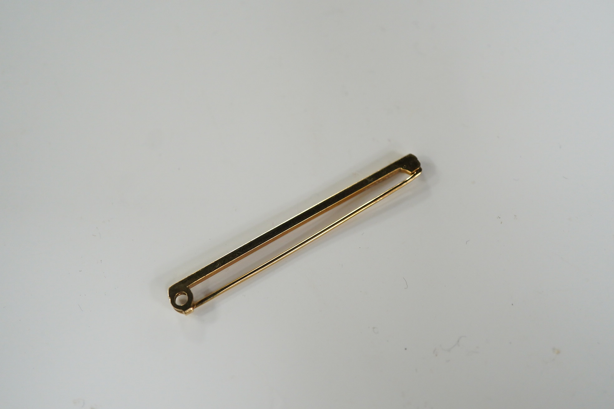 A 9ct gold tie pin, length 5cm, British hallmarks, gross weight approximately 2.5 grams